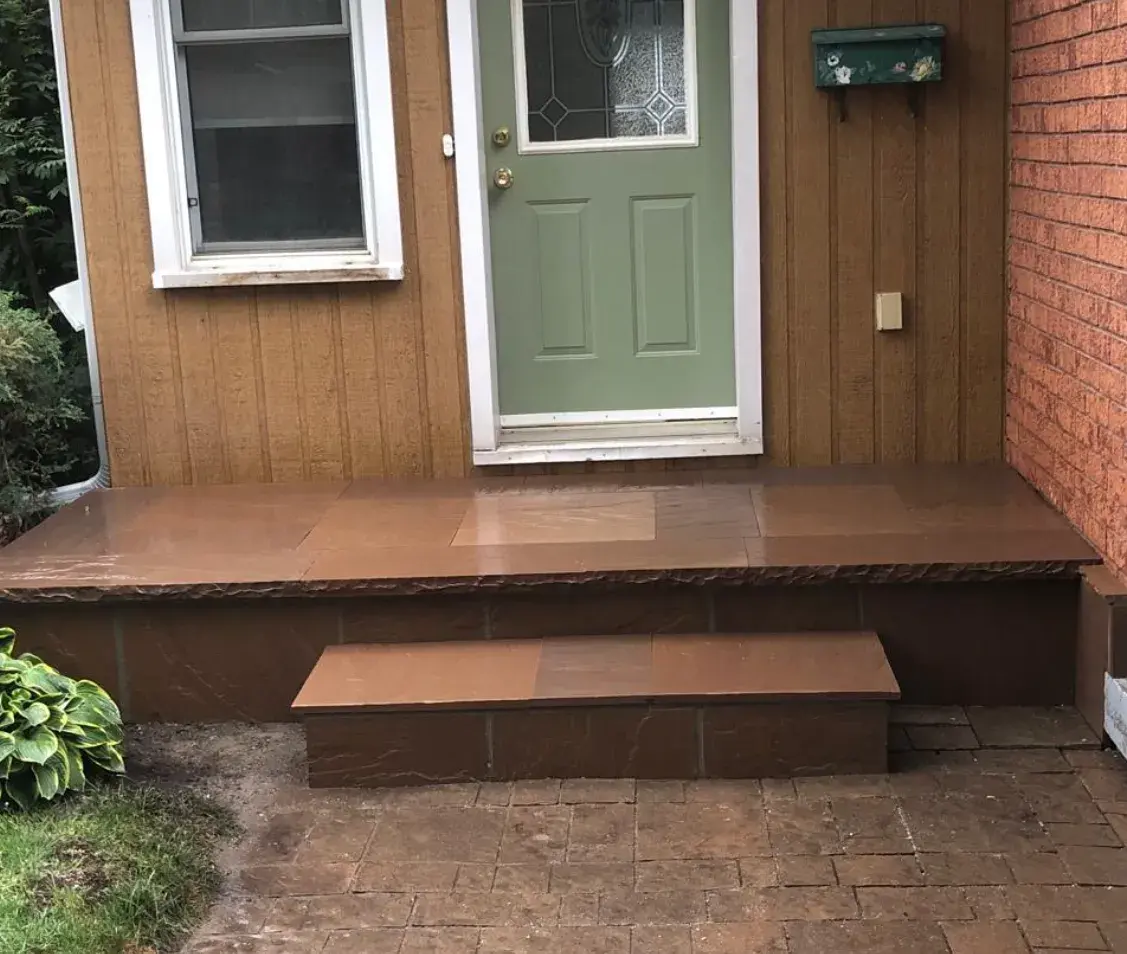 Refreshed front entrance with tidy steps and porch