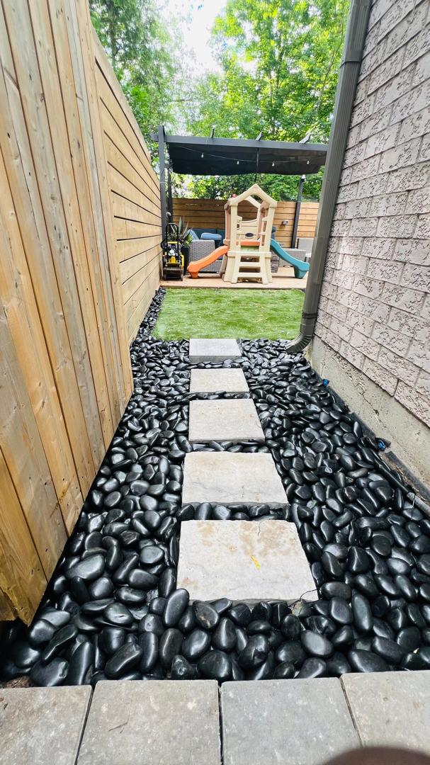 Elegant stone pathway with vibrant play space